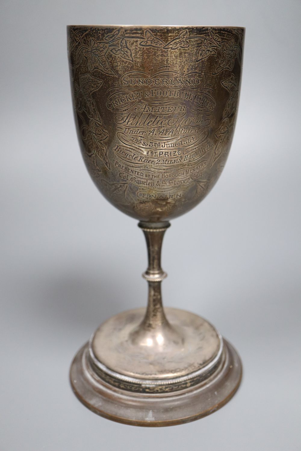 A Victorian silver presentation trophy goblet, engraved with a Penny Farthing, Birmingham, 1879, 22.6cm, weighted,